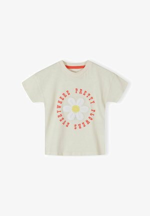 Kremasta majica kratkih rukava s velikim bijelim tratincem sa žutim središtem, crveni tekst oko njega glasi "Lijepe cvjetove posvuda."