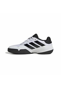 White athletic shoes with black accents. Mesh upper, textured toe cap, and a durable rubber sole. Three black stripes on the side.