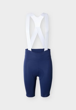 Tumši zili riteņbraukšanas šorti ar baltām elastīgām lencēm un polsterētu sēdvietu, attēloti uz gaiša vienveidīga fona.