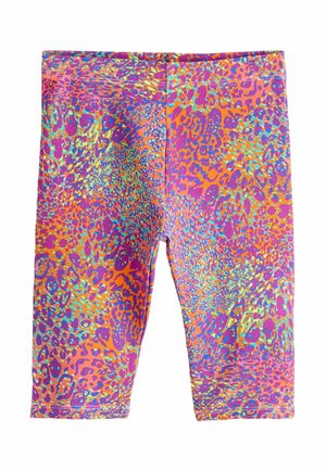Élénk, többszínű térdig érő leggings absztrakt leopárdmintával, narancs, lila, türkiz és sárga árnyalatokban.