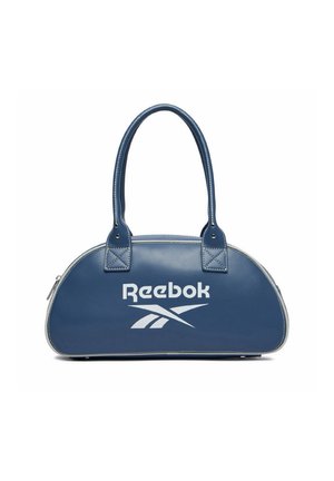 Niebieska torebka Reebok z podwójnymi uchwytami, o zaokrąglonym kształcie, z białym logo i zamkiem błyskawicznym na białym tle.