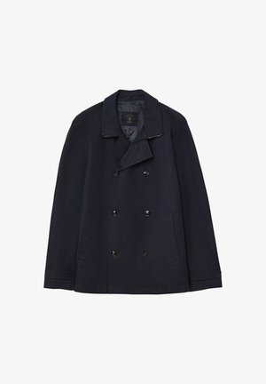Veste bleu marine à double boutonnage en tissu lisse, avec un large col cranté, deux poches latérales et des boutons noirs brillants.