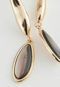 Next Pendientes - gold tone