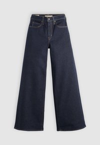 Jean en denim bleu foncé à jambes larges avec bouton devant, fermeture éclair, passants de ceinture et design à cinq poches sur fond clair.