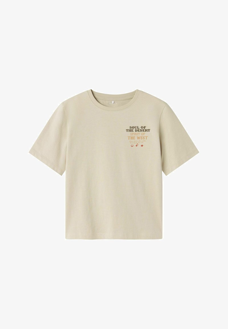 Krátký rukáv, béžové bavlněné tričko s kulatým výstřihem, s potiskem nápisu "DUŠE POUŠTĚ DUCH ZÁPADU" a motivy hvězd.