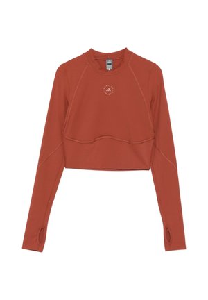 Top sportivo corto a maniche lunghe color ruggine con fori per i pollici e logo circolare al centro davanti vicino allo scollo.