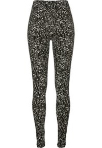 Leggings neri con un motivo di linee astratte bianche. Il tessuto sembra elastico con un design aderente e un cintura elasticizzata.