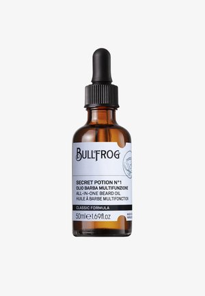 Bernsteinfarbene Glasflasche mit schwarzer Pipettenkappe. Weiße Etikett zeigt "Bullfrog Secret Potion N°1" und Produktdetails in schwarzem Text.