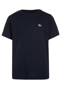 Marinblå bomulls t-shirt med klassisk rund hals, korta ärmar och en liten grön krokodil-logotyp på vänster bröst.