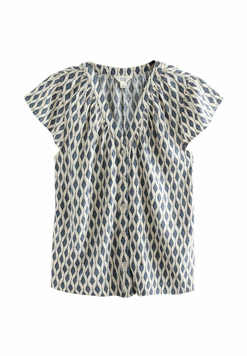 Blusa a maniche corte in crema e blu, con scollo a V, chiusura a bottoni e un motivo a diamanti e foglie con dettagli arricciati.