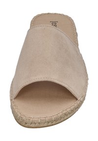 Beige suede slip-on sandal with a wide open toe, natural fiber outsole, and stitched detailing along the sole edge. Flat design with minimal height.