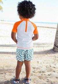 Next SUNSAFE SET - REGULAR FIT - Jogginghose - orange checkerboard