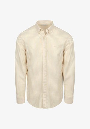 Beige blouse met lange mouwen met witte verticale strepen, een knoopkraag en knoopmanchetten.