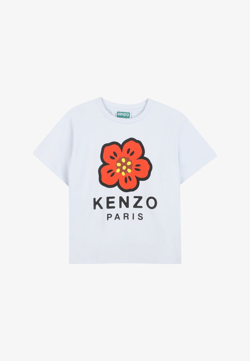 T-shirt en coton blanc arborant un grand motif floral rouge avec des contours noirs et des centres jaunes, accompagné d'un texte noir indiquant "KENZO PARIS".