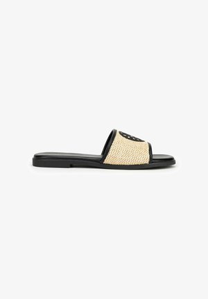 Slide sandal with a woven natural straw upper, black trim, and a flat black sole. Features an open toe design and embroidered detailing.