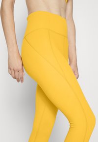 Girlfriend Collective COMPRESSIVE HIGH RISE - Tights - golden glow