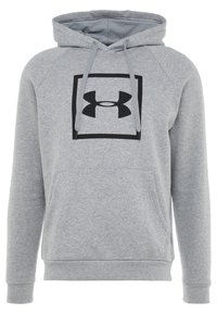 Sudadera gris hecha de tela suave, con un bolsillo frontal, cordones y un logo negro dentro de un cuadrado en el pecho.