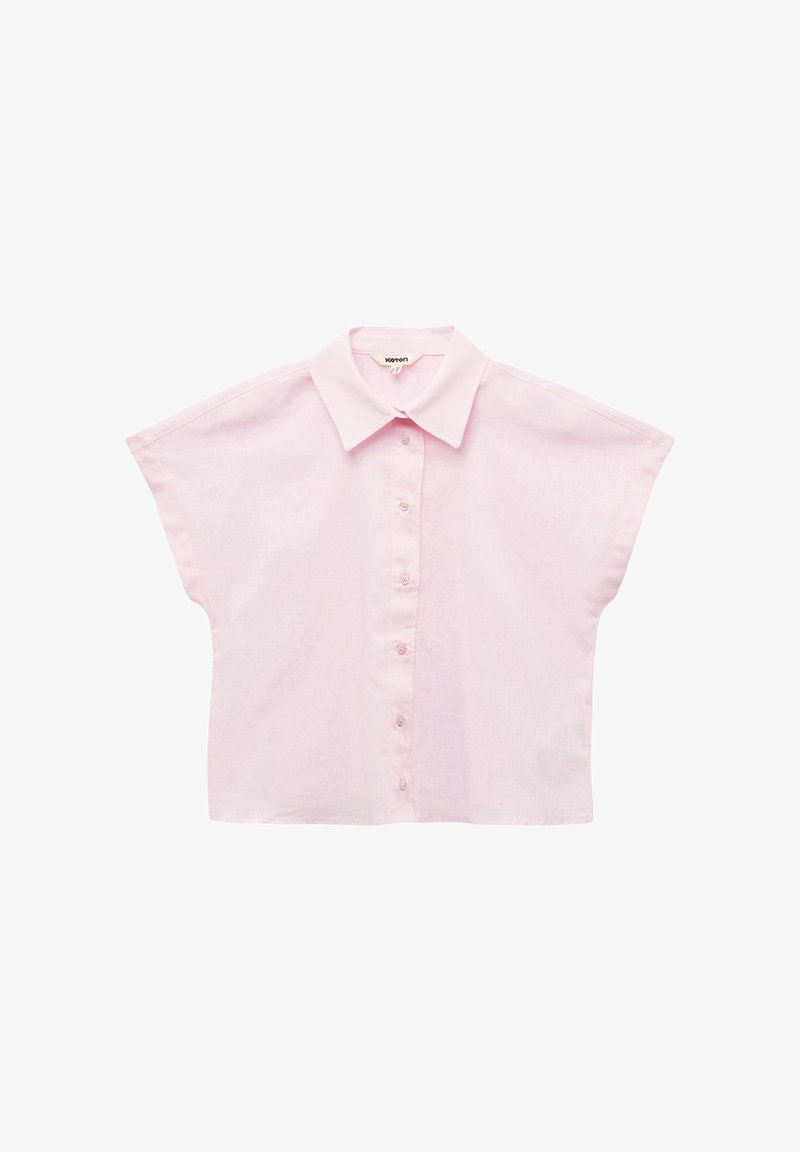 Camicia a maniche corte, con bottoni, in cotone rosa chiaro, caratterizzata da un colletto a punta, vestibilità rilassata e una leggera texture.
