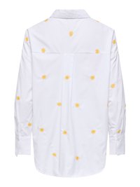 Chemise blanche à manches longues avec un col, présentant des petits motifs éclat de soleil jaunes dispersés sur le dos et les manches.
