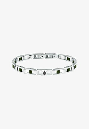 Armband aus Edelstahl mit grünen Keramikeinsätzen, flachen Gliedern und einem schwarzen Emblem. Polierte Oberfläche mit abwechselnd strukturierten Abschnitten.