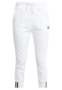 Pantaloni jogger bianchi realizzati in materiale morbido, con vita elasticizzata, tasche laterali e dettagli a strisce nere sui polsini.