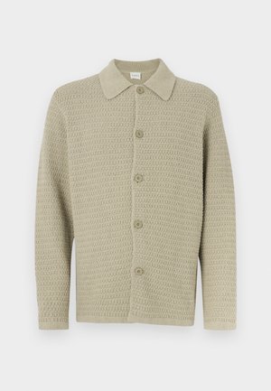 Light beige knitted cardigan with a collared collar, featuring a button-front closure and textured fabric. Long sleeves with ribbed cuffs.