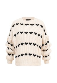 Krémový pletený svetr s černými srdcovými vzory uspořádanými v horizontálních řadách a nařasenými rukávy.