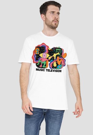 White cotton t-shirt featuring a colorful abstract graphic print with the text "MUSIC TELEVISION" in bold black letters.