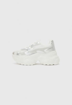 Silver sneaker with a textured mesh upper and iridescent accents, featuring a chunky white sole and lace-up closure.