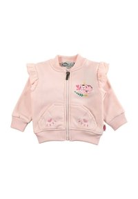 Veste zippée rose avec épaules à volants, motif tigre brodé, accents floraux et poches en forme d'empreintes de pattes, en tissu de coton doux.