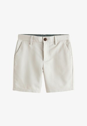 Beżowe krótkie spodenki do kolan z szlufkami na pasek, zapinane z przodu na guziki, z bocznymi kieszeniami, prezentowane na białym tle.