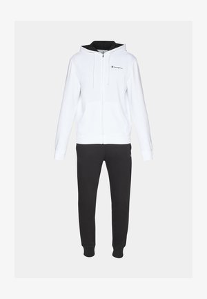White zip-up hoodie with a black interior lining and logo on the chest, paired with black sweatpants featuring a logo at the hip.