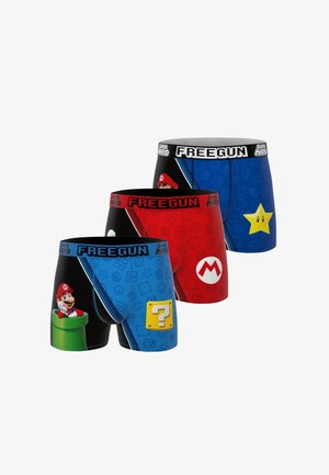 Trois paires de boxers Freegun avec des dessins Super Mario : Mario dans un tuyau, un bloc question, l'emblème de Mario, et une étoile jaune sur des fonds bleu et rouge.