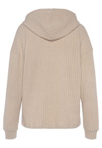 Beżowy sweatshirt z prążkowaną fakturą, ma kaptur, długie rękawy i luźny krój. Prosty design bez dodatkowych ozdób.