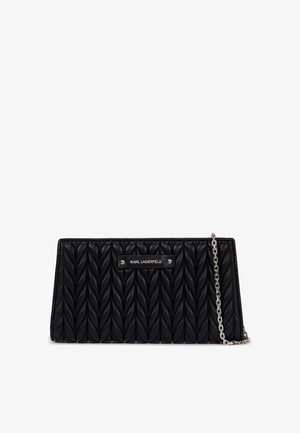 Black leather clutch with quilted, braided texture. Features a silver chain strap and a silver logo plate embossed on the front.