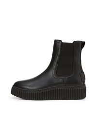 Bottine noire en cuir avec des panneaux latéraux élastiques, bout arrondi et semelle en caoutchouc épaisse et crantée pour l'adhérence. Design minimaliste et finition mate.