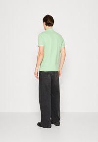 BOSS PASSERTIP - Polo shirt - open green