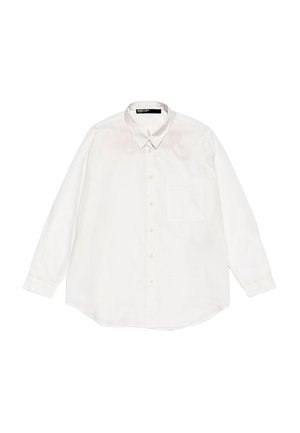 White long-sleeve shirt made of lightweight fabric, featuring a pointed collar, front pocket, and buttoned front. Has faint stains on shoulders.