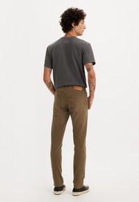 Levi's® 512™ SLIM TAPER - Slim fit jeans - forest foliage gd