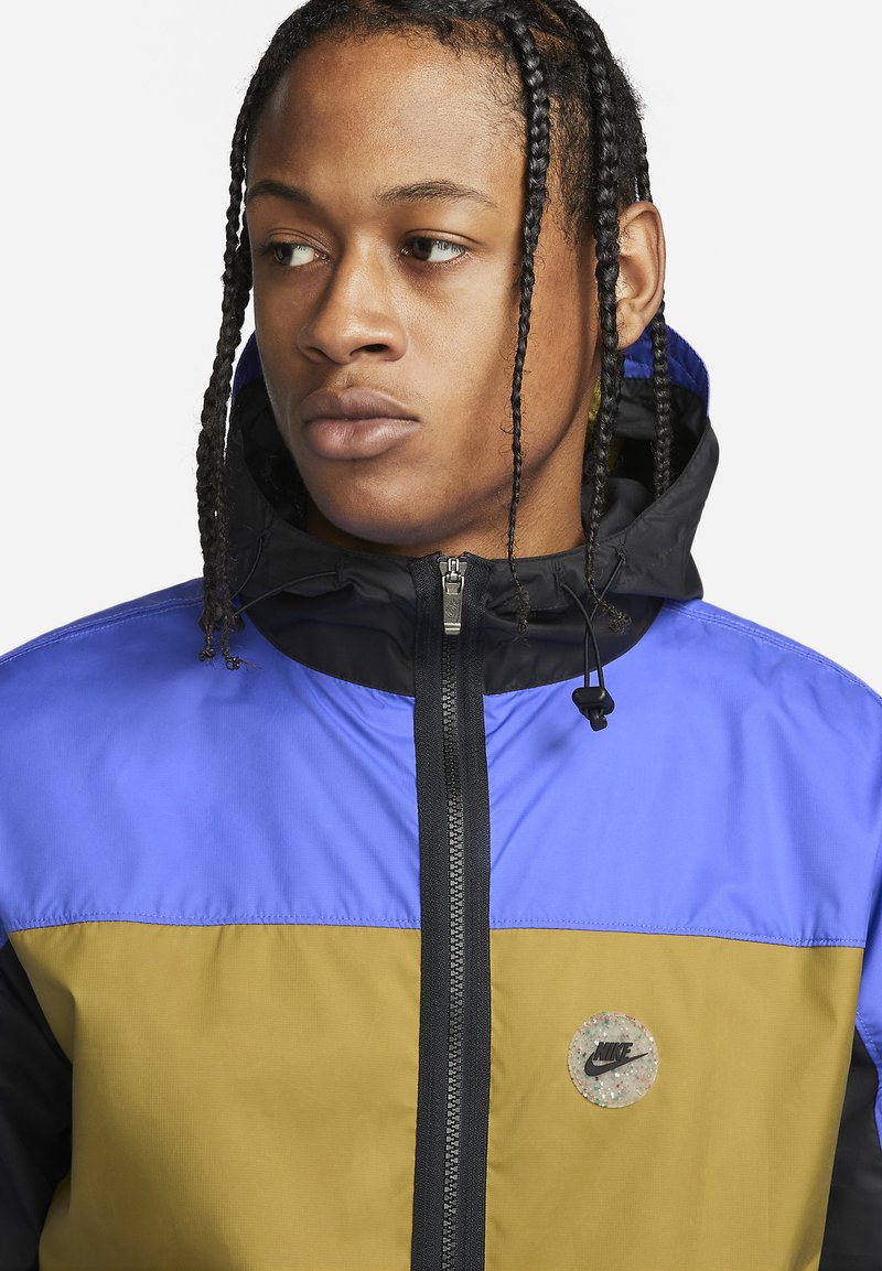 black gold nike jacket
