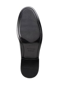 Zwarte leren schoenzool met tekstuur patroon van rubber grip. Heeft een gladde rand en een gegraveerd "WITCHEN handmade" merk.