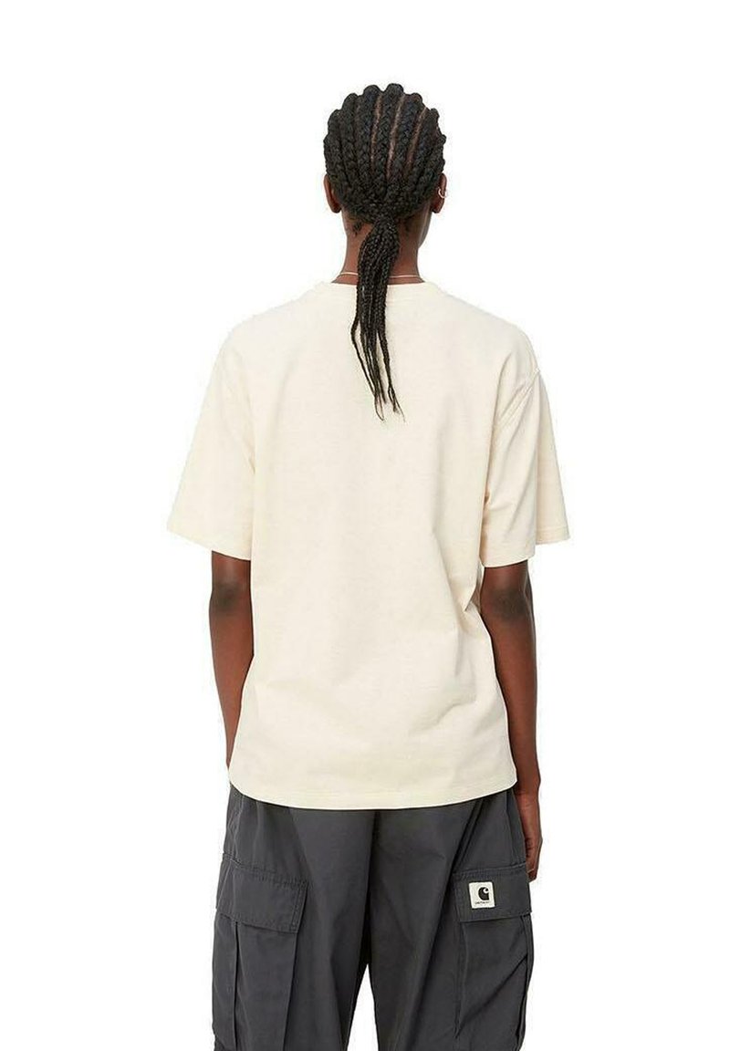 Cream cotton t-shirt with short sleeves, relaxed fit, and a crew neckline. Worn with dark cargo pants featuring side pockets.