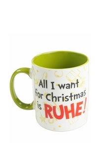Ceramic mug with a green handle and interior. White exterior features a print with the text "All I want for Christmas is RUHE!" in black and red.