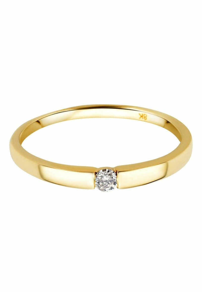 Bague fine en or 18 carats avec un petit diamant rond serti au centre de l’anneau poli.