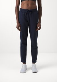 adidas Sportswear ESSENTIALS SMALL LOGO FEEL COZY OPEN HEM PANT - Calças de fato de treino - legend ink