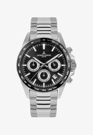 Edelstahl-Armbanduhr mit schwarzem Zifferblatt, drei Hilfszifferblättern, leuchtenden Zeigern, Tachymeterskala und glänzendem Gliederarmband.