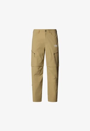Pantalones exteriores beige con un corte relajado, bolsillos con cremallera en los muslos y puños ajustables. Fabricados con un tejido ligero y duradero.