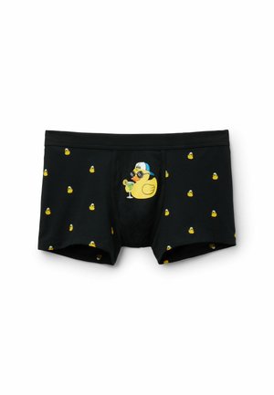 Schwarze Boxershorts mit Muster aus kleinen gelben Gummienten und einer großen Gummiente mit Sonnenbrille und Kappe, die einen Cocktail hält.