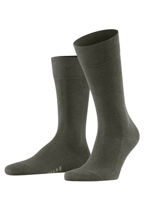 Olivgrüne knöchellange Socken aus weichem Stoff, mit elastischen Rippbündchen und glatter Oberfläche, verstärkter Zehen- und Fersenbereich.