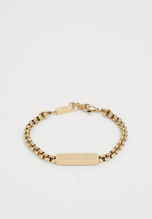 Gold bracelet with a textured link design, featuring a flat bar in the center. Includes a clasp closure and engraved detailing.